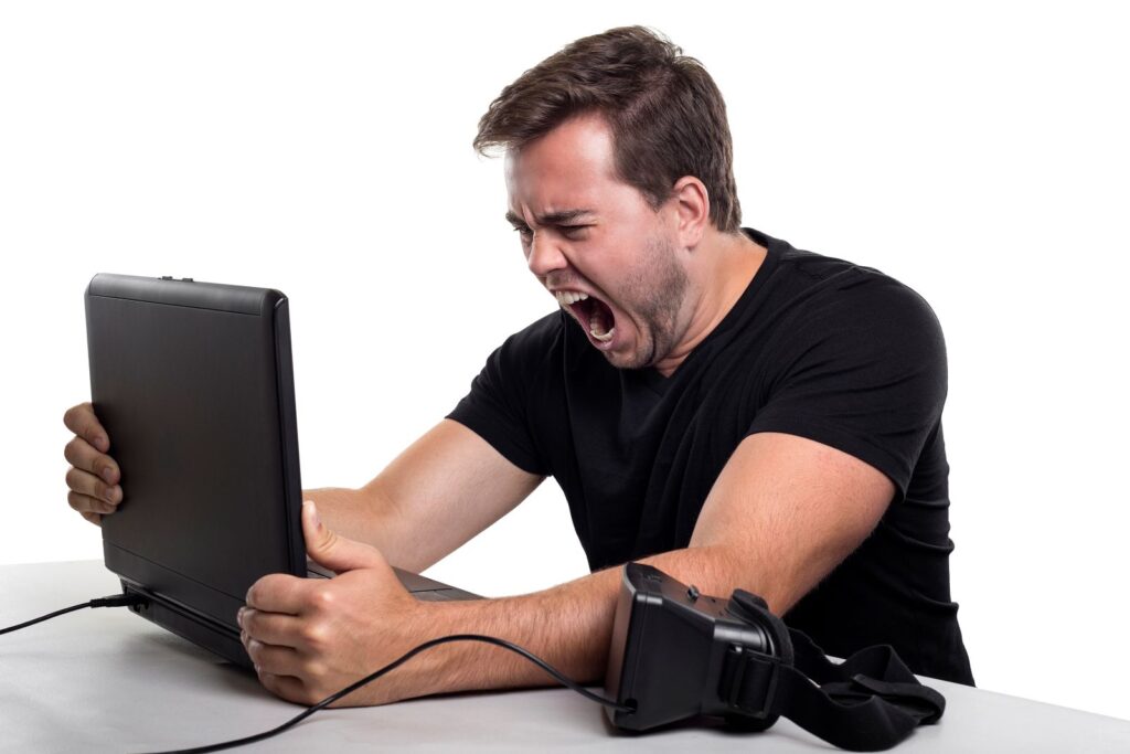 angry man who is stressed at work, yelling at his computer