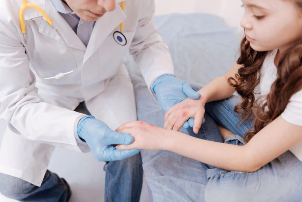 child being checked by doctor